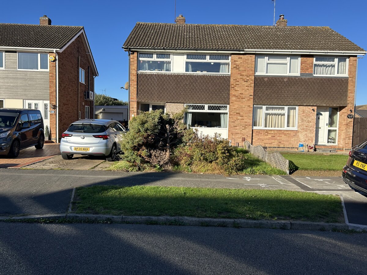 Worn driveway surface before replacement in Kettering