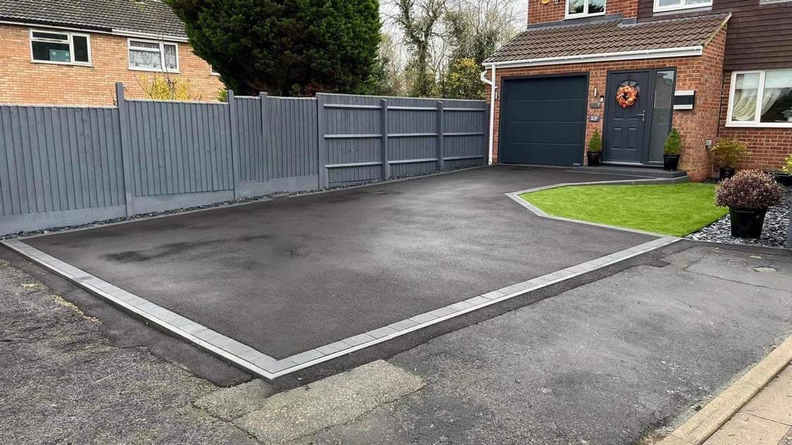 New tarmac driveway with block kerb edging in Rushden